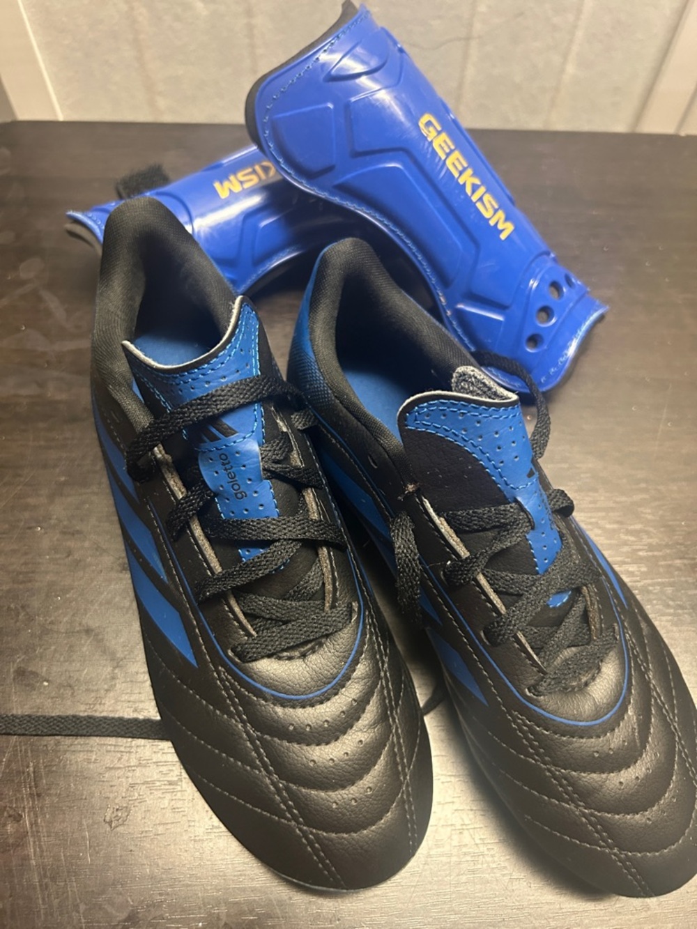 Black and Blue Soccer Cleats with Blue Shin Guards